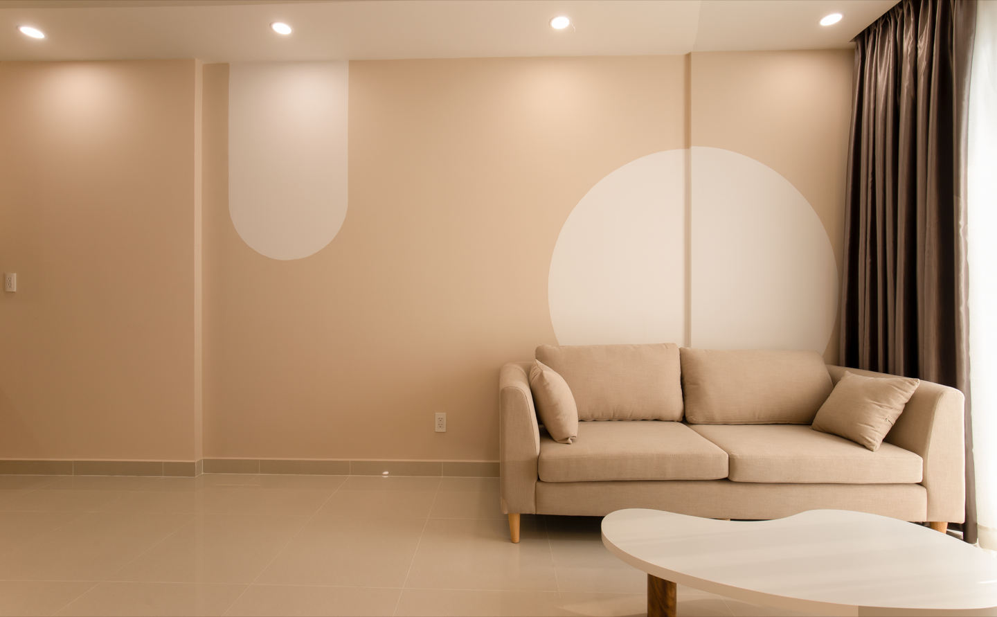 Airbnb living space before and after repainting in a warm greige — after, restyled by Restage