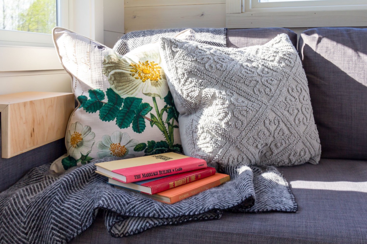 Rental living room before and after repainting in a warmer gray — after, restyled by Restage