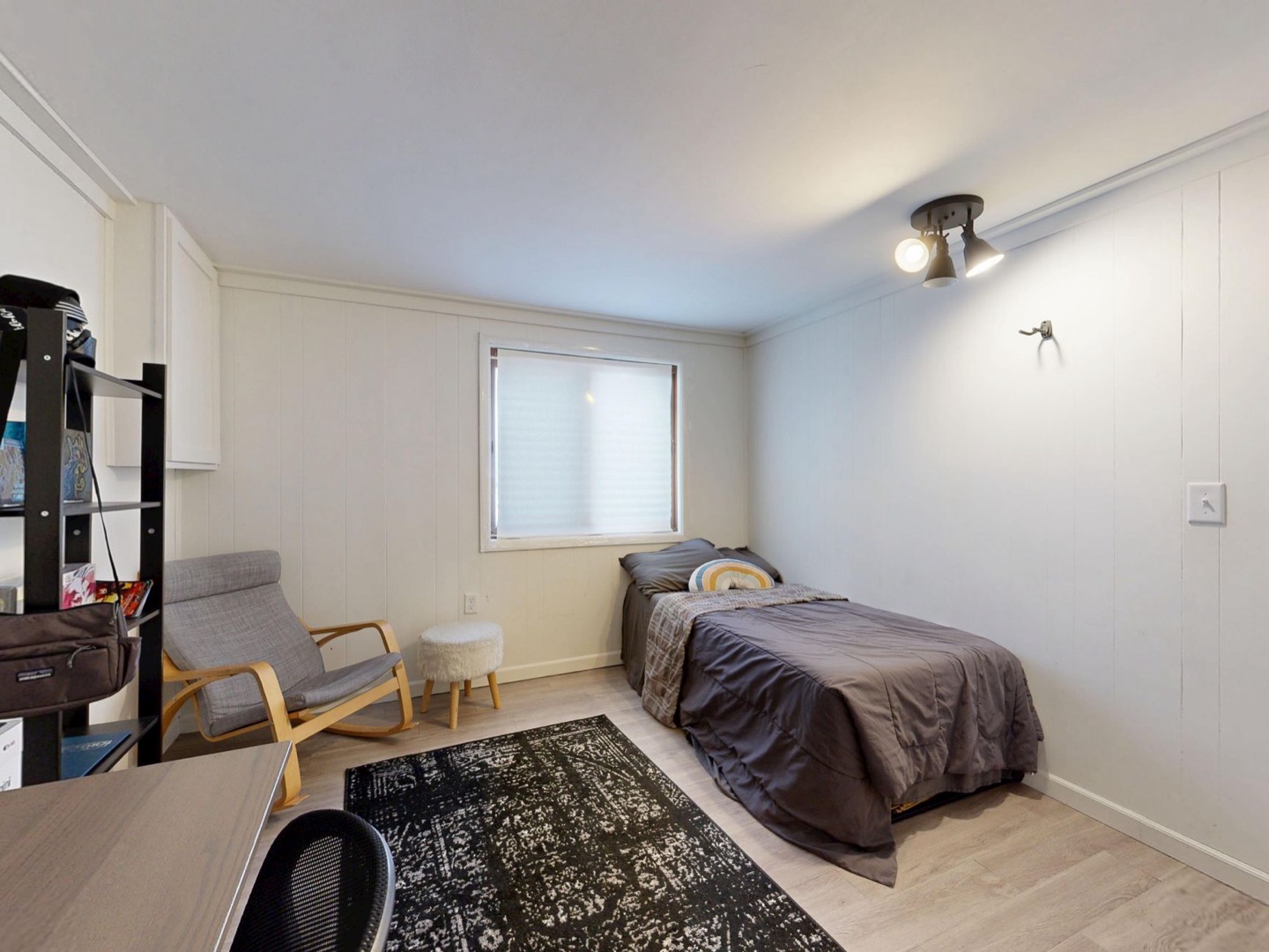 Airbnb bedroom shown before and after a previewed redesign — after, restyled by Restage