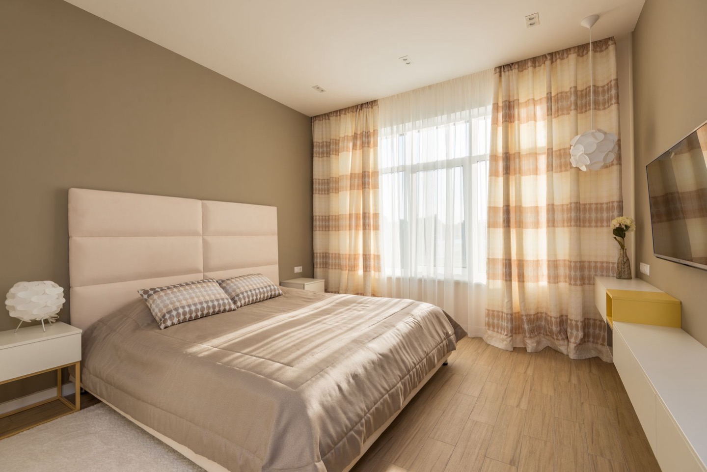 Airbnb bedroom before and after adding layered blackout window treatments — after, restyled by Restage