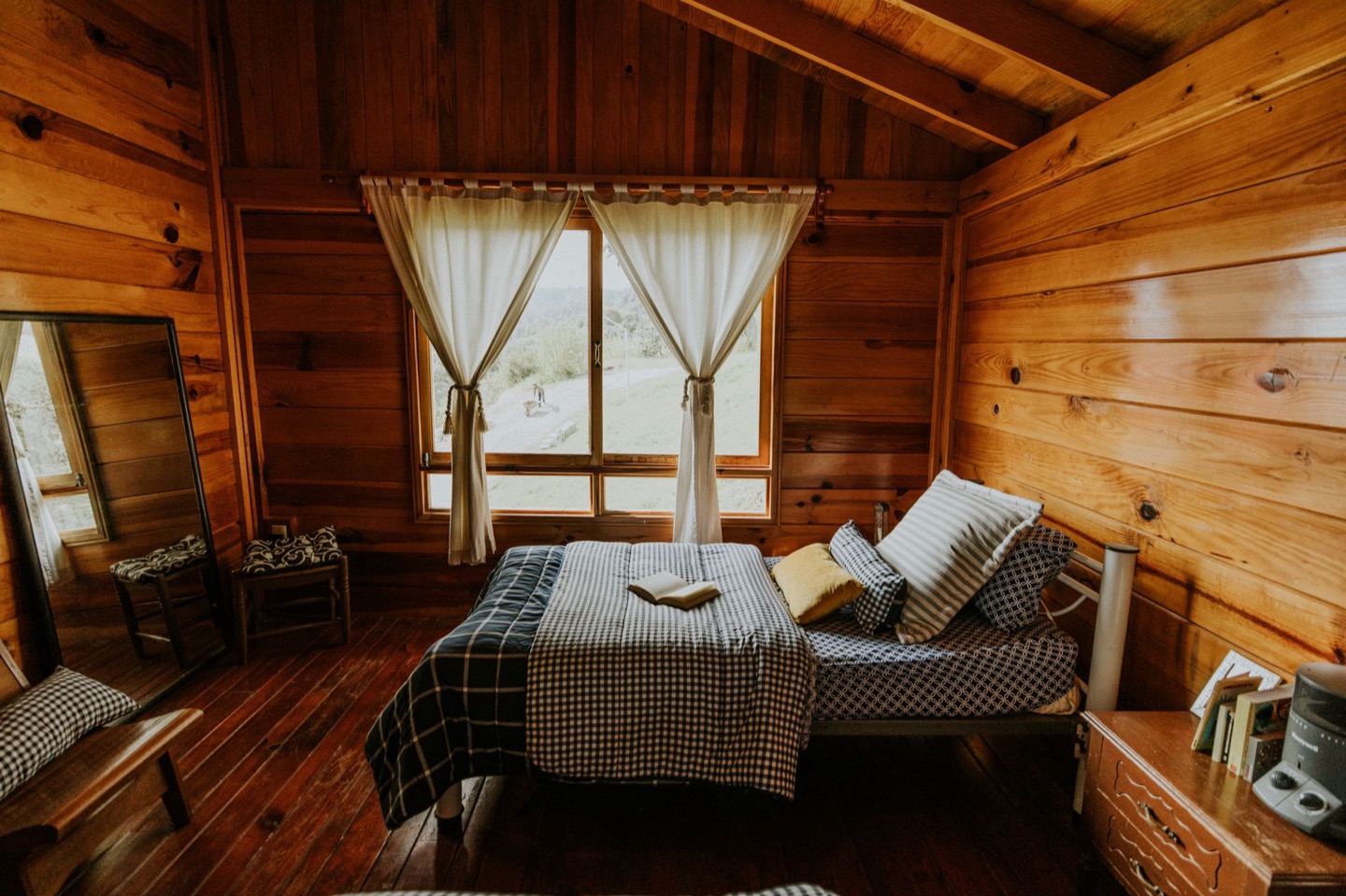 Cabin Airbnb living room before and after staging — after, restyled by Restage
