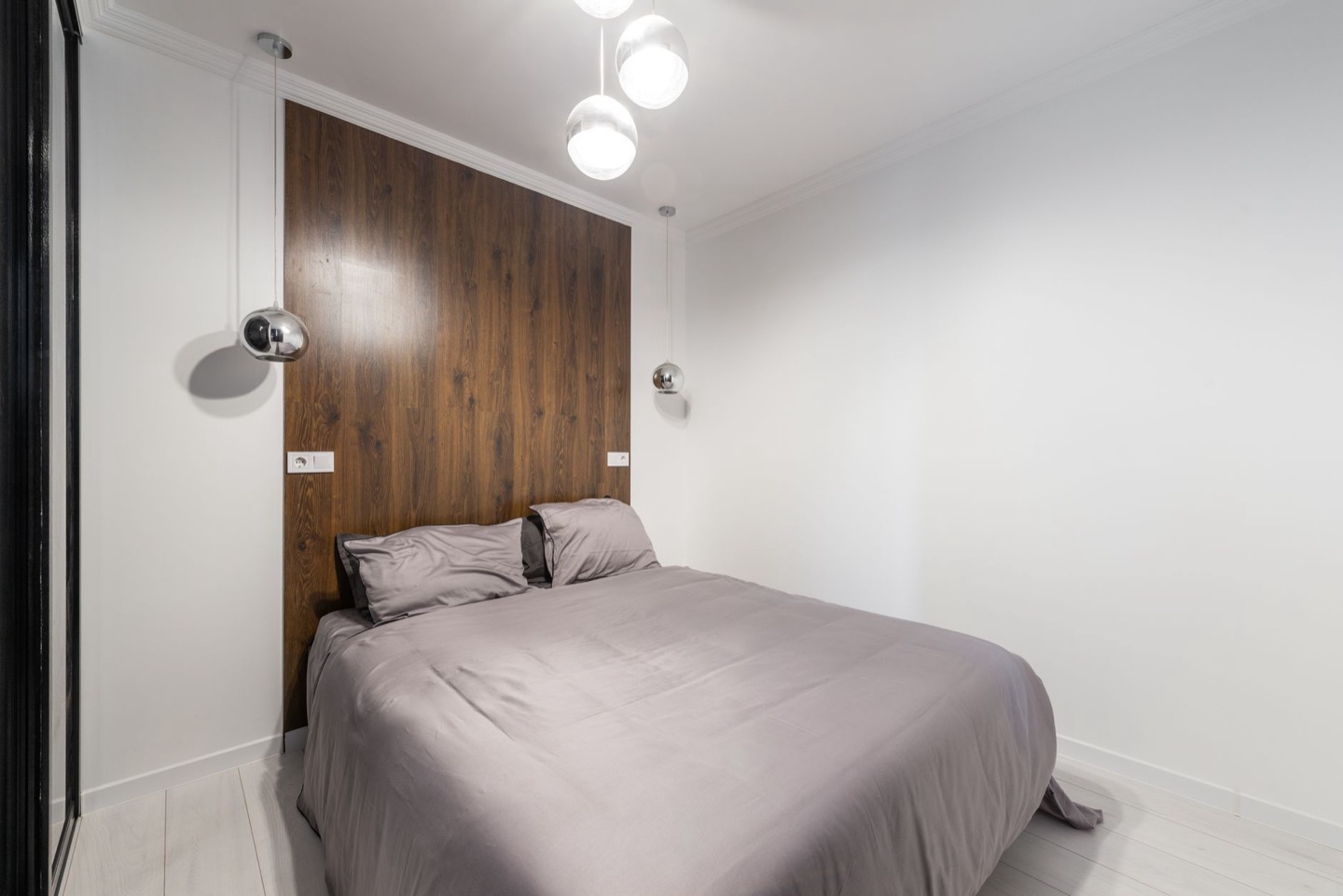 Airbnb bedroom before and after resizing the bed to fit the room — before
