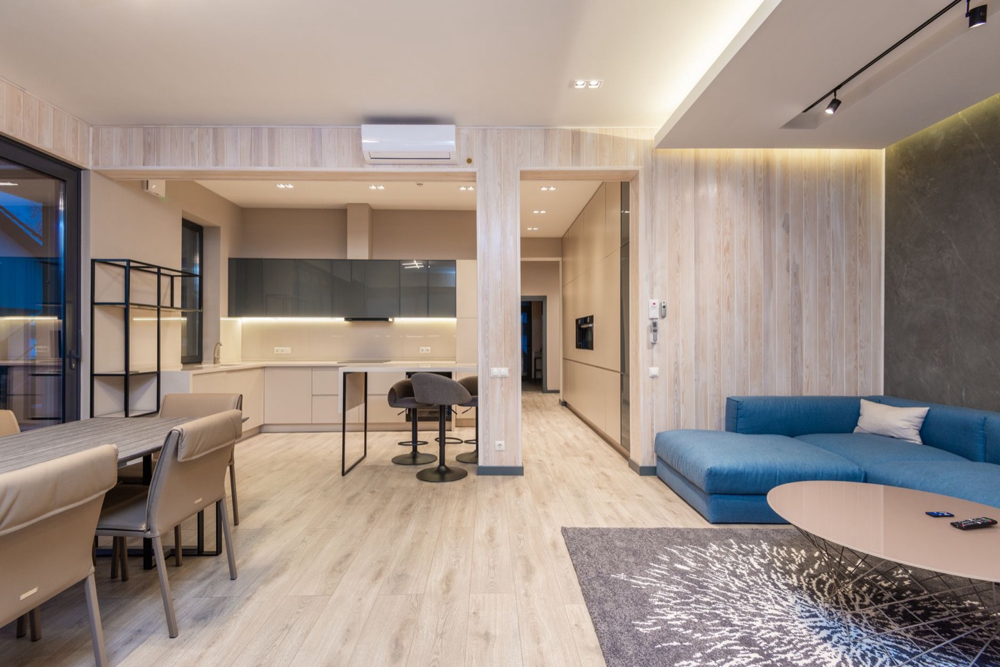 Airbnb room before and after replacing worn flooring — after, restyled by Restage