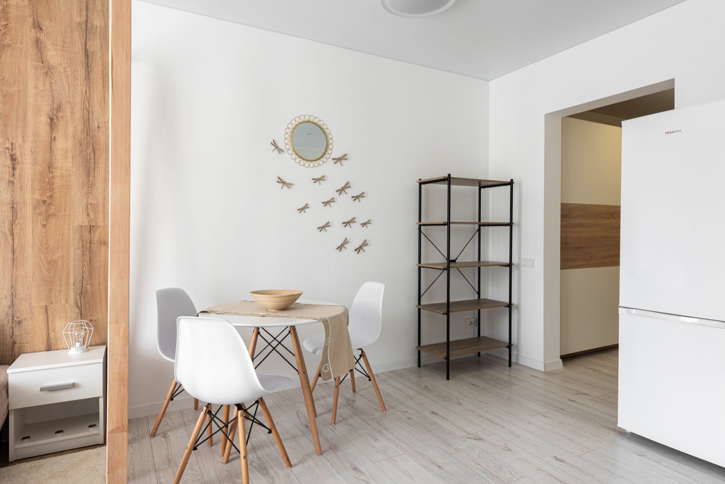 Rental room before and after repainting in a clean warm white — after, restyled by Restage