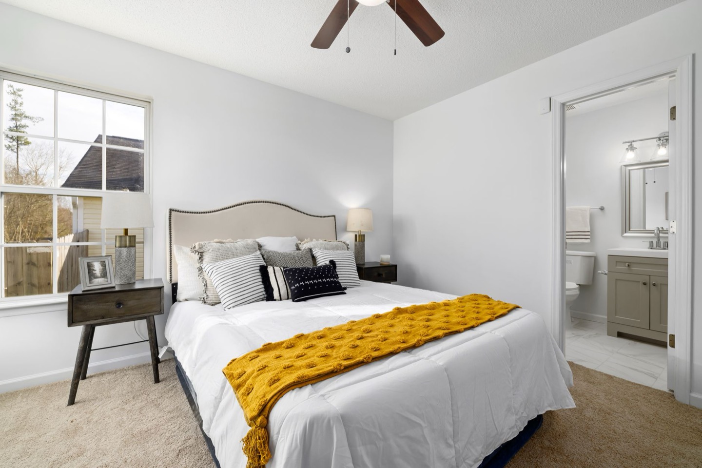 Small Airbnb bedroom before and after staging — after, restyled by Restage