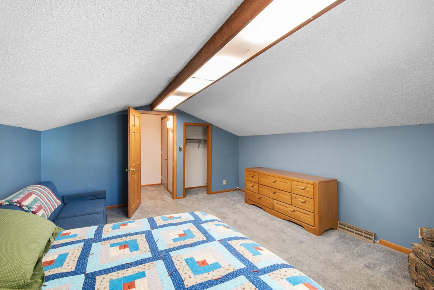 Airbnb bedroom before and after a tested wall color change — before