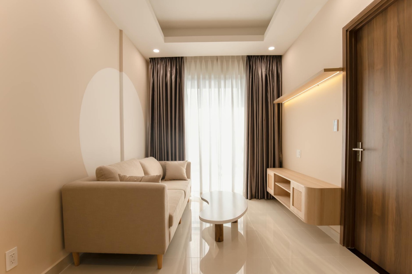 Airbnb living room before and after warm minimal styling — after, restyled by Restage